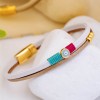 Handmade leather bracelet with gold-plated metal parts and enamelled evil eye