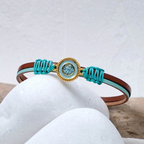 Handmade leather bracelet with gold-plated metal parts and glittered enamel