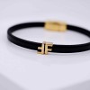 Leather bracelet with initial letter and metal parts in gold-plating